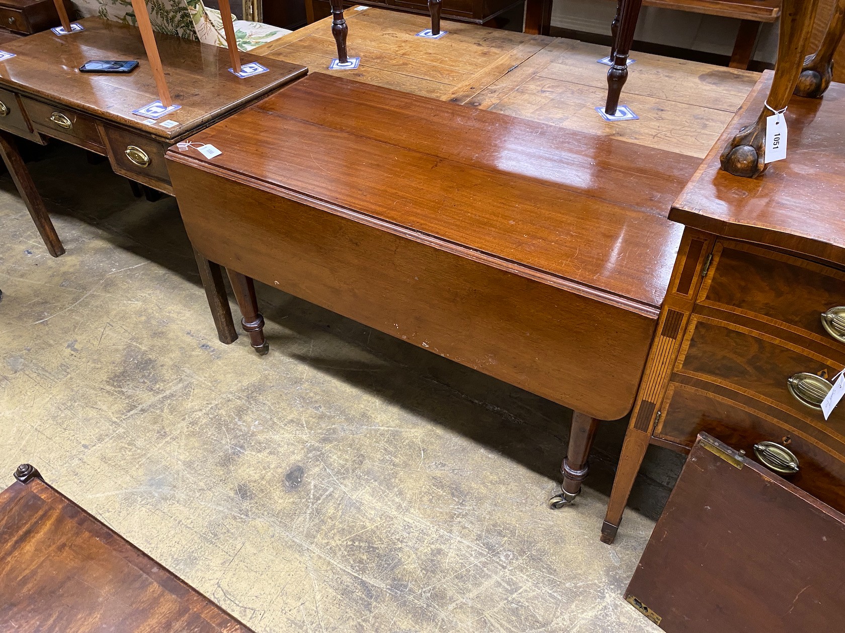 An early Victorian mahogany drop leaf extending dining table length 168cm extended, one spare leaf, depth 122cm, height 74cm